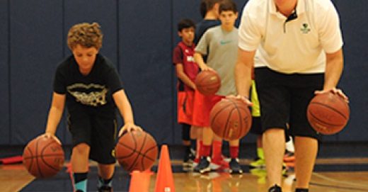 Kids doing basketball drills.