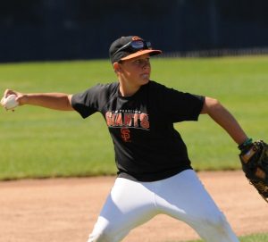 Boy about to pitch a baseball.