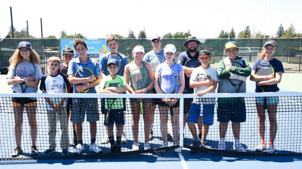 Tennis group phot on the court.