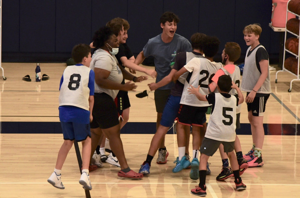 Excited basketball coaches and players.