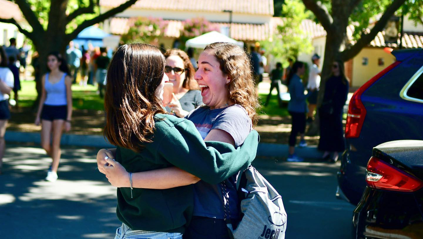 Campers hugging.