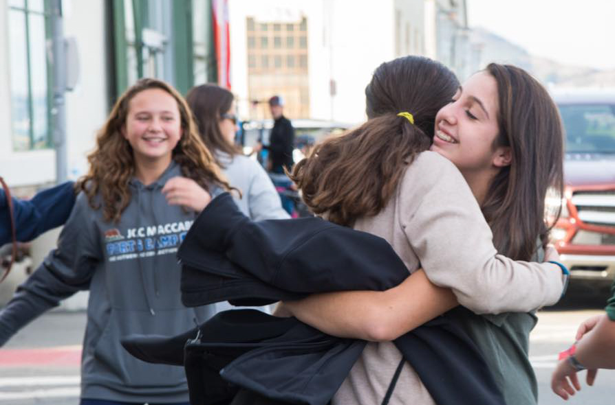 Campers hugging.