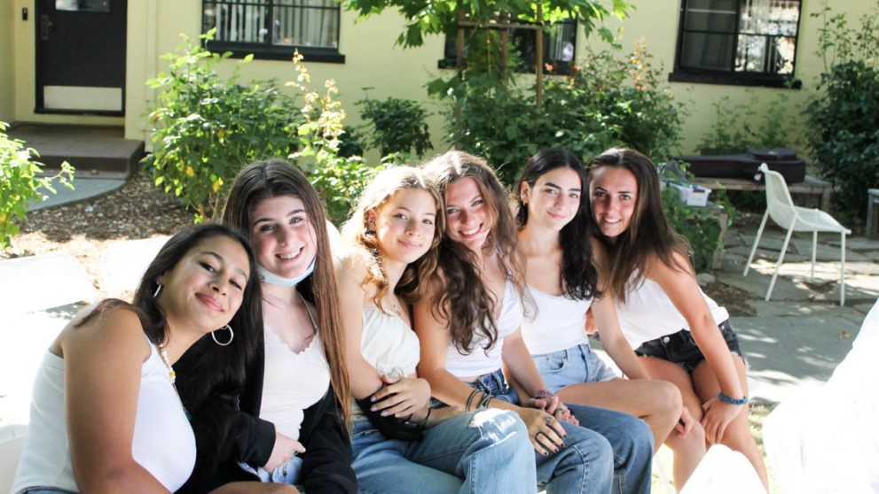 Group of girls sitting together at Sabbath.