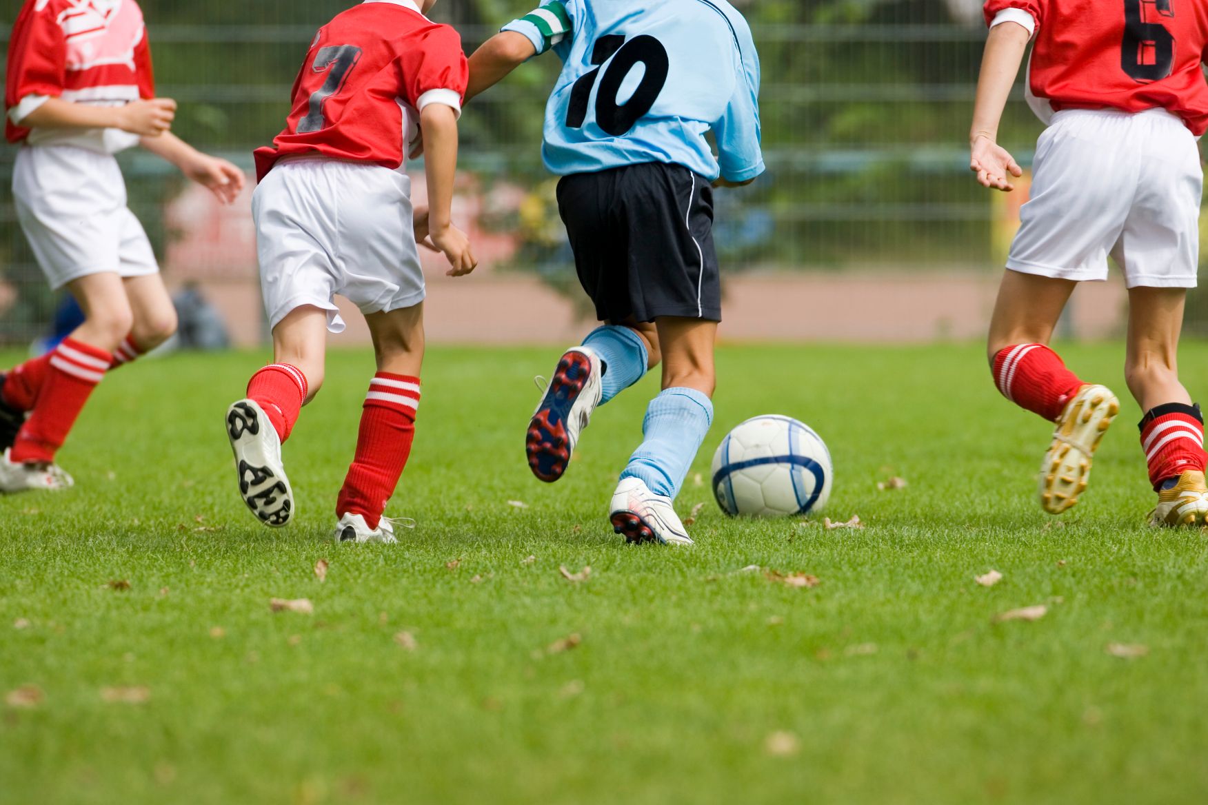 Kids playing soccer.