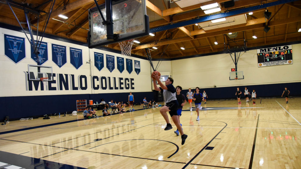 Basketball campers playing a game of basketball.