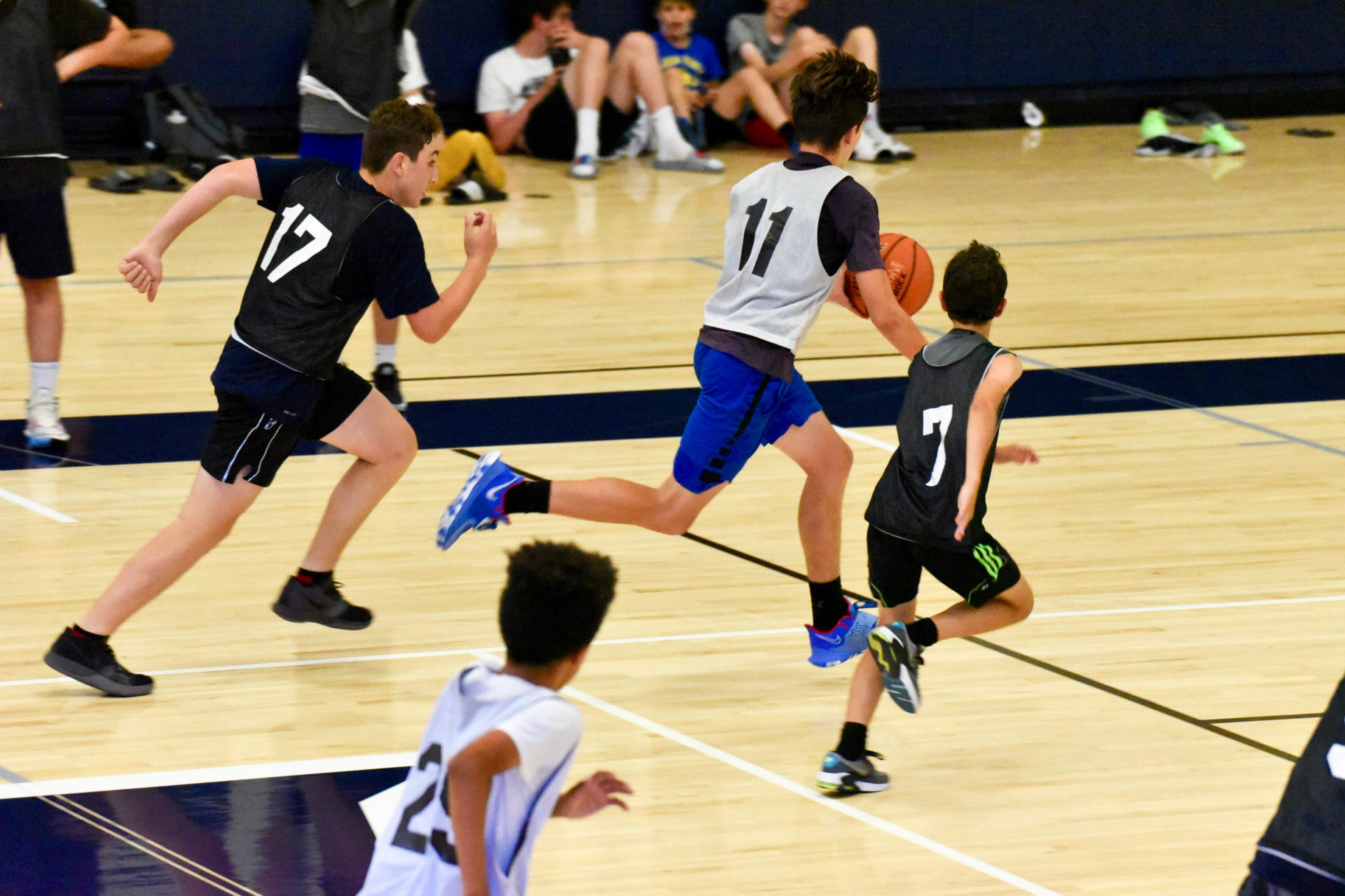 Campers playing a basketball game.