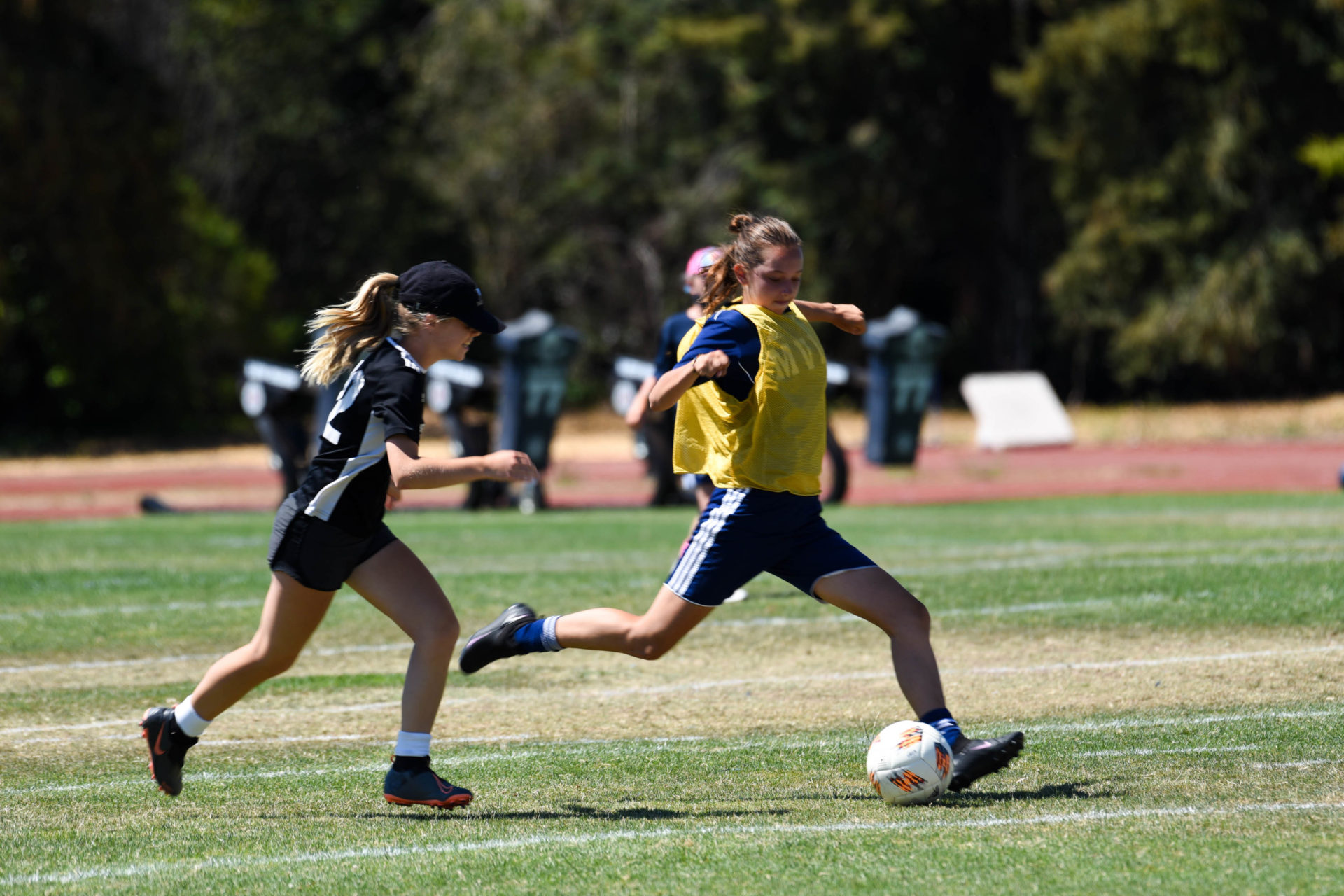 Girls playing soccer.