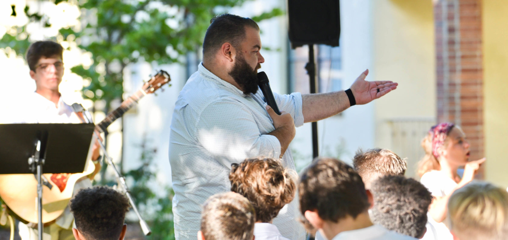 Counselor speaking at Shabbat.