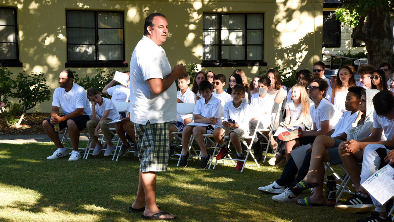 Counselor speaking at Shabbat.