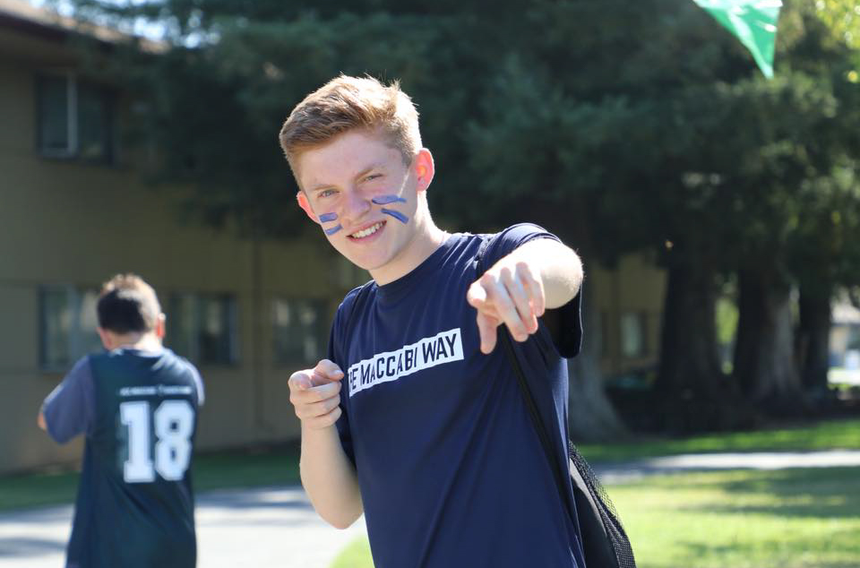 A camper wearing a Maccabi t-shirt.