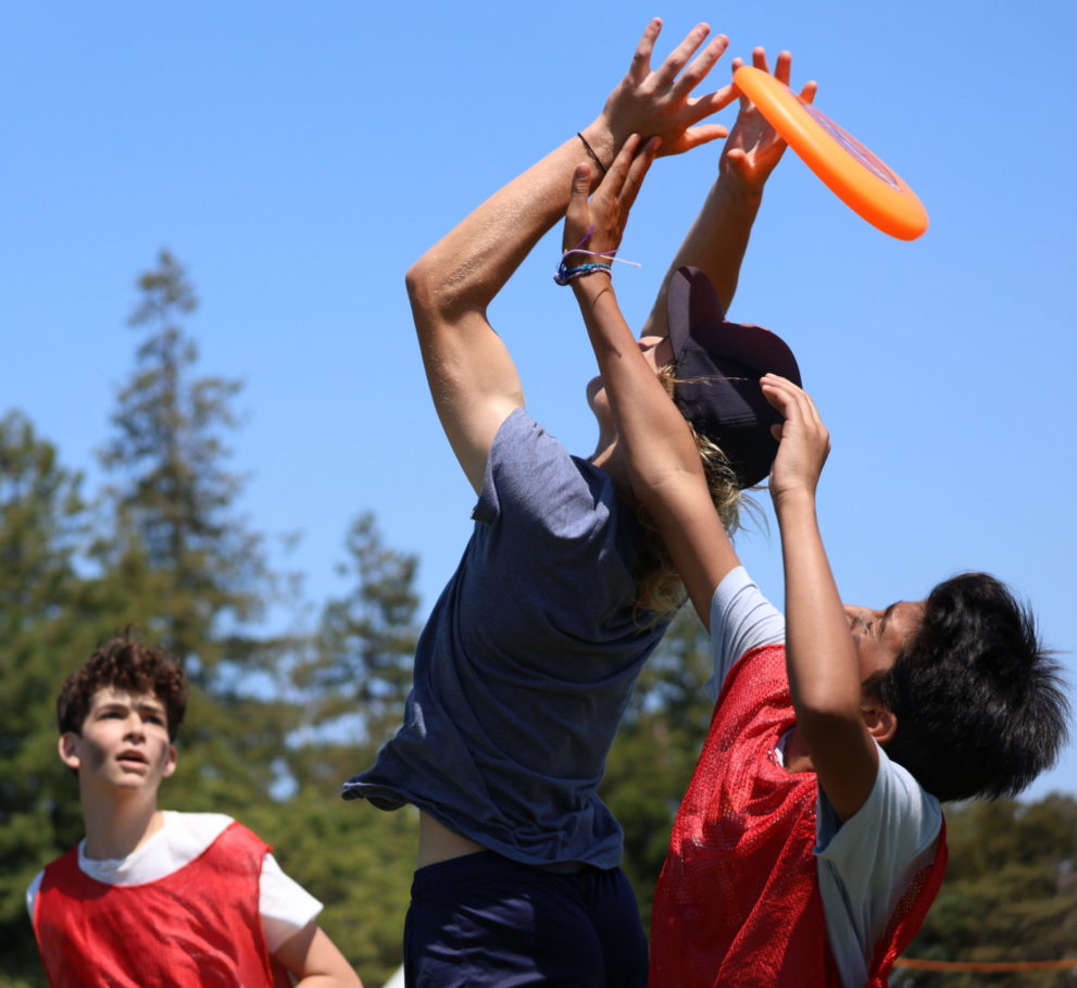 Camper catches a frisbee in an Ultimate Frisbee match